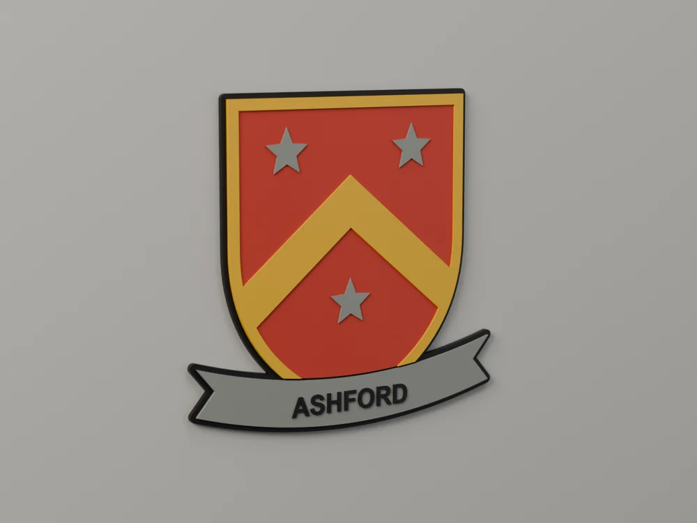 A 3D printed family crest plaque: a red shield with a yellow chevron and three grey stars, above a grey banner reading ASHFORD
